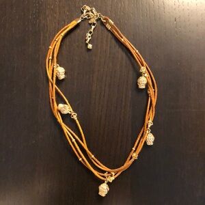 Super cute multi strand suede and skull necklace